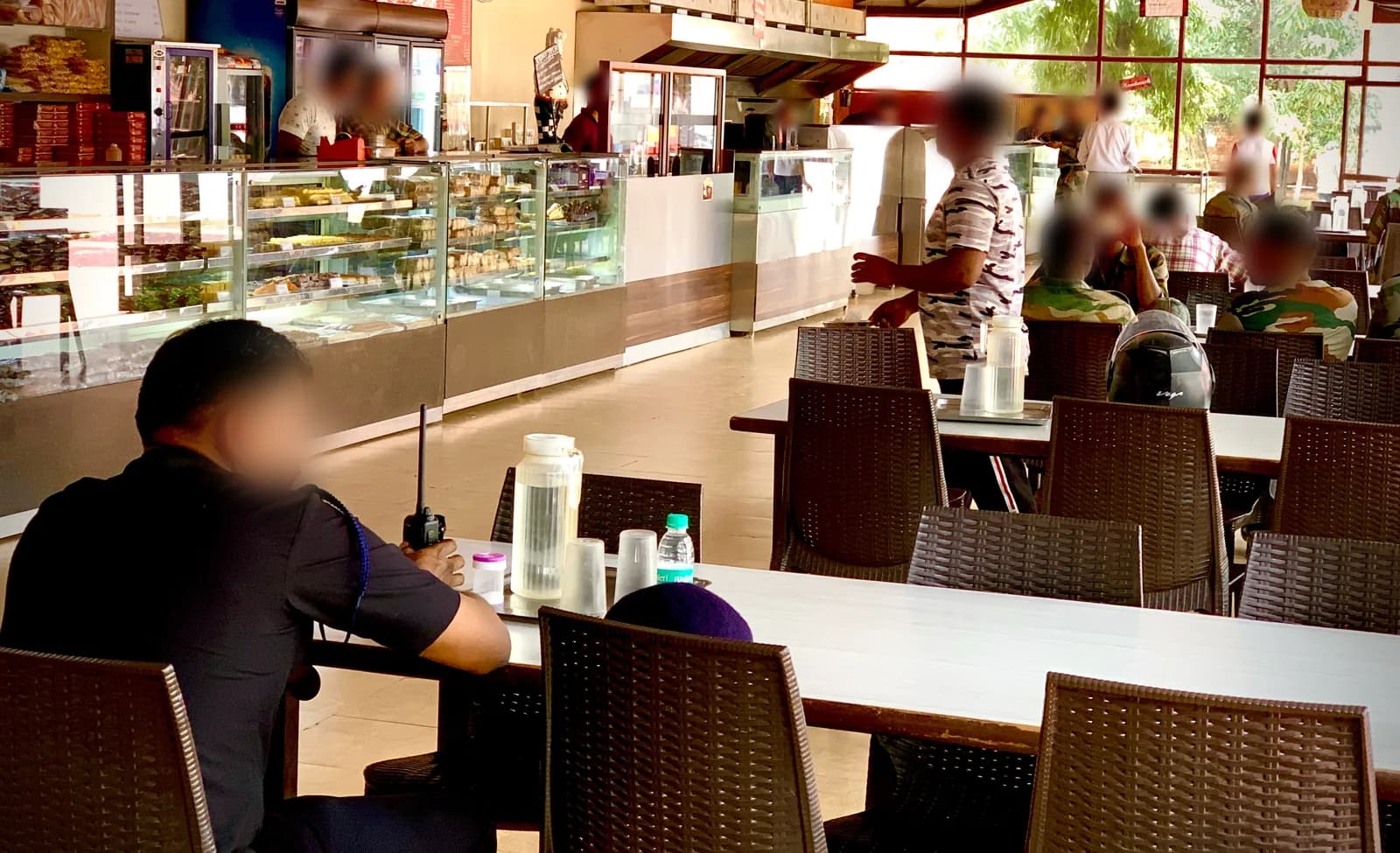 Our store inside the MEG Centre, Bengaluru: sweet and bakery counters, with jawans at the tables